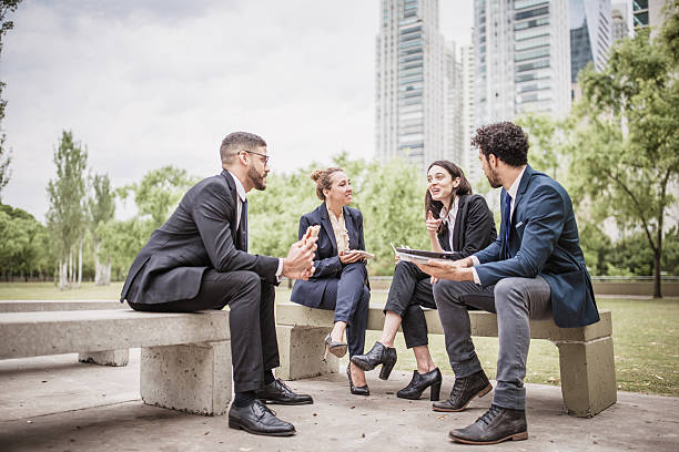 istock Business Team Meeting Outdoors with Skyscrapers in Background 2239068647