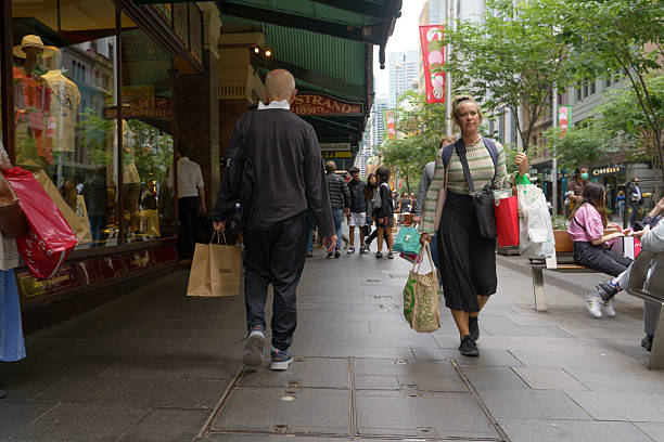Sydney, Australia, 22 December 2022- A flow of diverse shoppers in Sydney CBD, carrying branded bags and enjoying a day of retail. Captures the modern and cosmopolitan atmosphere of the city.