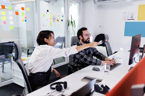 istock Business meeting in modern office with diverse professionals collaborating on project 2239070401