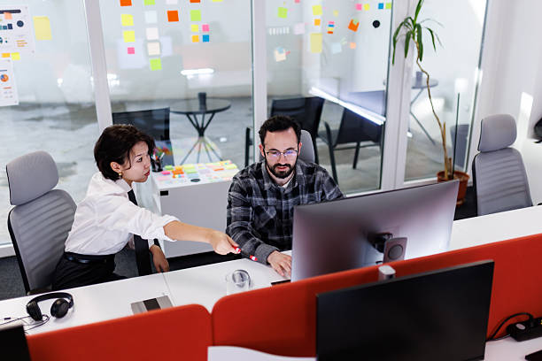 istock Business professionals collaborating on a project in a modern office setting during the day 2239070424
