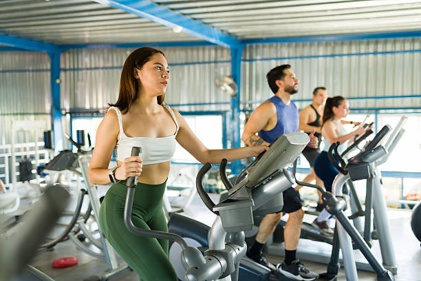istock Group of people doing workout on elliptical machines 2239071395