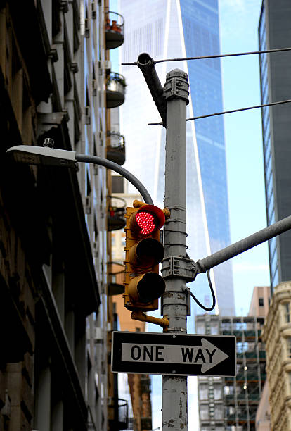 istock red traffic light one way sign skyscraper background Manhattan 2239101504