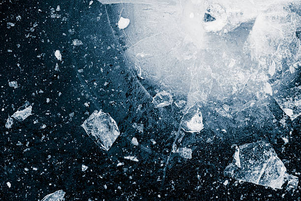 istock Ice cubes crushed on a black background. Chill backdrop. 2239101783