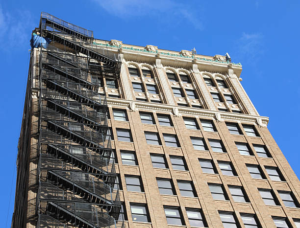 istock tall skyscraper with a very long metal emergency stair 2239101878