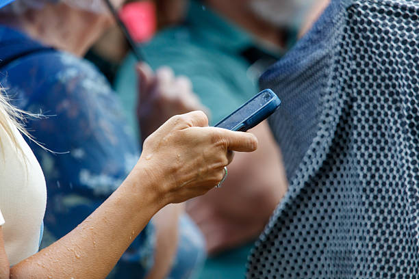istock A woman is holding a cell phone in her hand 2239106555