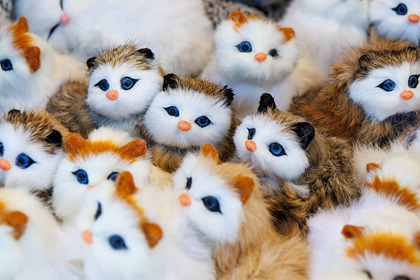istock A bunch of stuffed cats are sitting on a table 2239106985