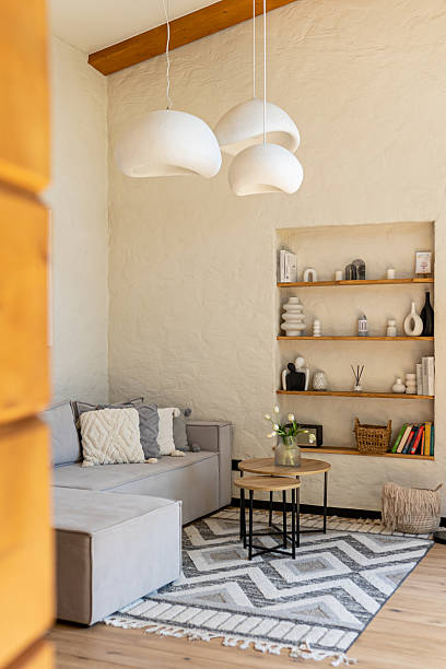istock Stylish home interior with soft gray sofa, coffee table and Scandinavian design 2239108225