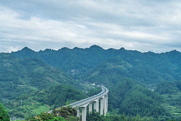 istock Highway bridge in green valley 2239110326