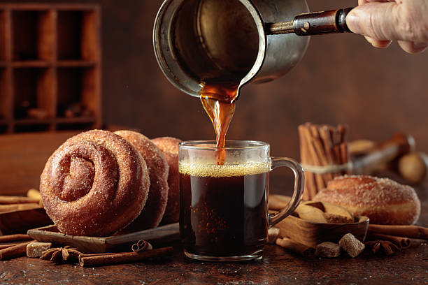 istock Swedish cinnamon rolls and black coffee. 2239111512