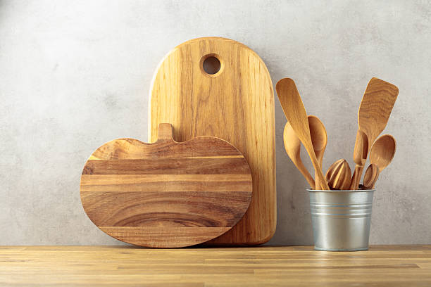 istock Wooden kitchen utensils on a wooden table. 2239111529