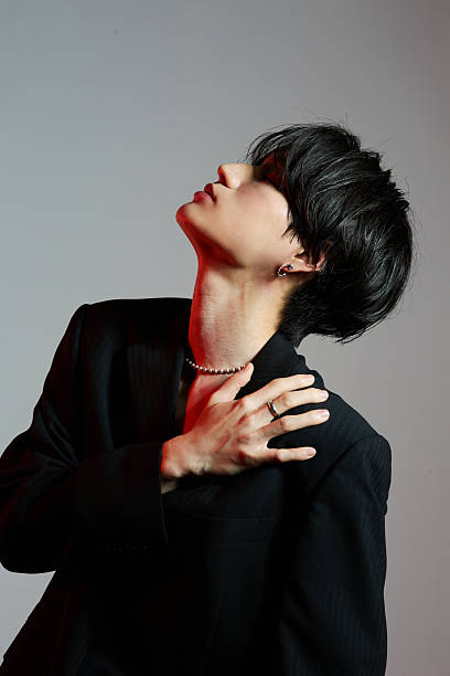 Portrait of a cool young Asian man with makeup
