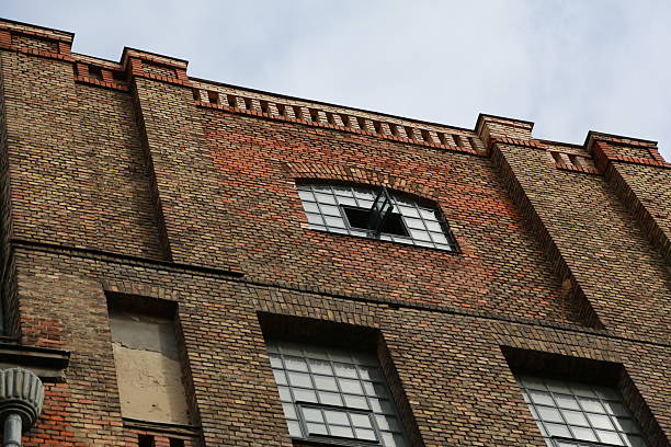 istock Industrial top window on the brick wall 2239117087