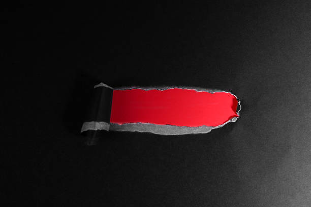 istock Torn paper with space for your message, isolated on black background 2239118716