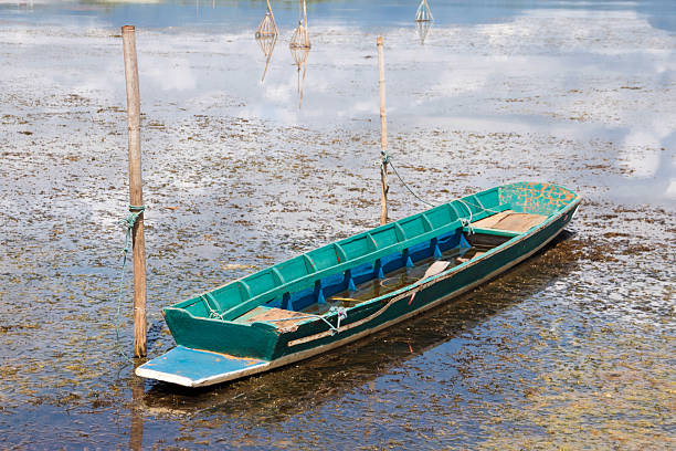 istock Long tail boat parked on the banks 2239120038