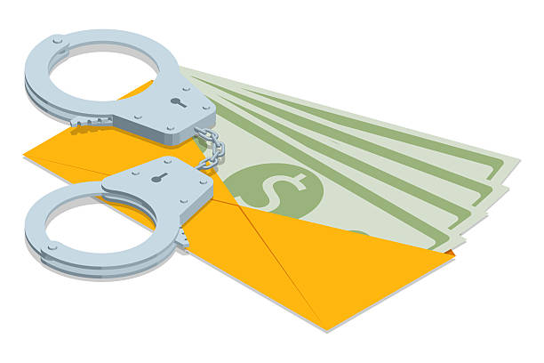 istock Isometric vector illustration of handcuffs on top of dollar bills. The image symbolizes financial crime, fraud, bribery, and corruption, perfect for law enforcement, justice, and economic issues. 2239121226