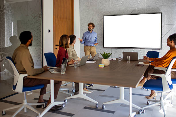 istock Business Presentation Mockup: Confident Leader in Modern Conference Room 2239121838