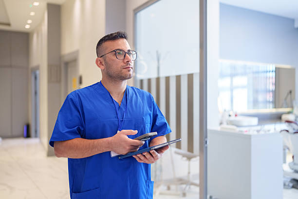 istock Dentist Using Digital Tablet for Patient Records and Communication 2239122975