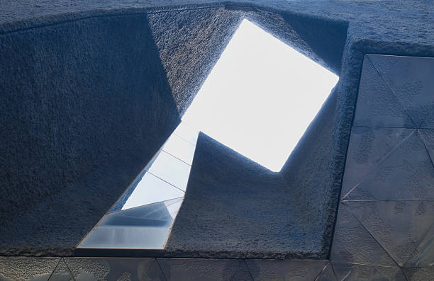 Berlin, Germany - 05 May 2018: Berlin Holocaust memorial in Berlin at the background of blue sky, bottom view