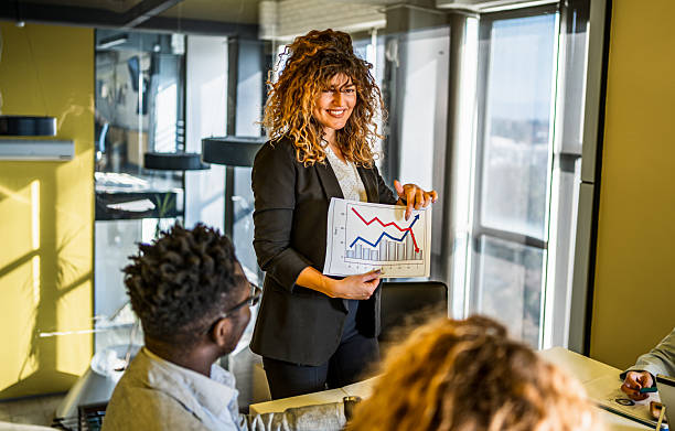 istock Woman presenting business data chart during meeting 2239128666