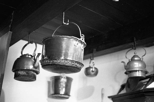 Kitchen cabinetry of pots and teapots