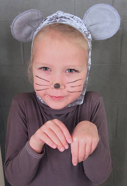 istock Young blond girl dressed up as a mouse. 2239131467