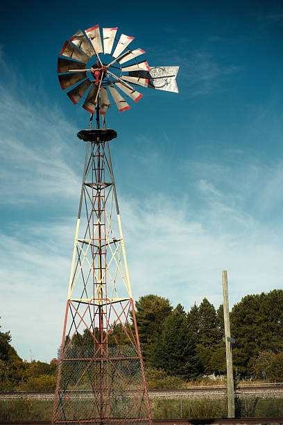 istock Vintage Water Pumping Windmill and Railway Crossing 2239131469