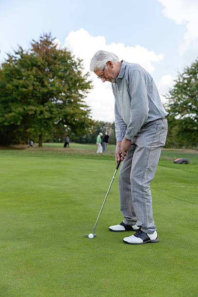istock Handsome senior retired man playing golf in Europe 2239131606