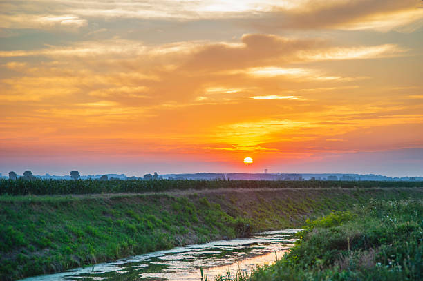 istock Sunrise by the canal with water 2239135697