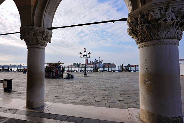 Historic arch view to Venice waterfront Italy
