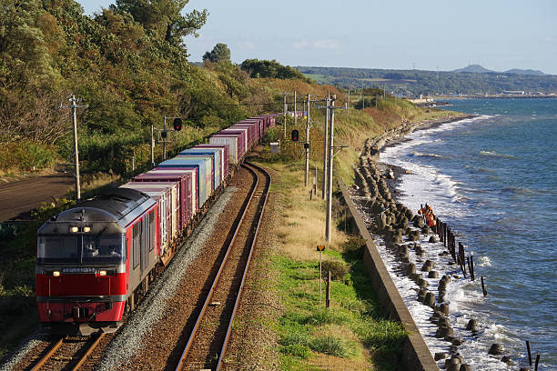Date-city, Hokkaido, Japan - September 27, 2025 : DF200 series Freight train running along the coastline