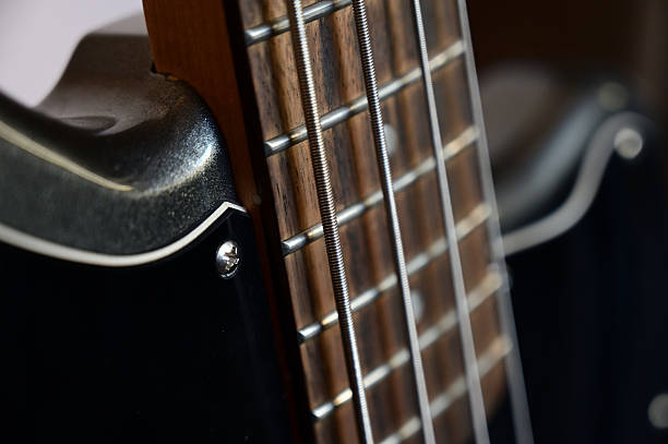 istock Fragment of a guitar at close range — strings, soundboard, neck. 2239140341
