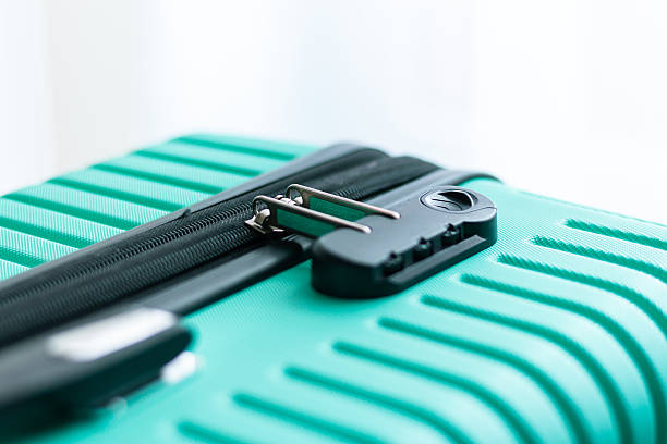 istock A close-up of a locked combination padlock attached to a turquoise suitcase. 2239141836