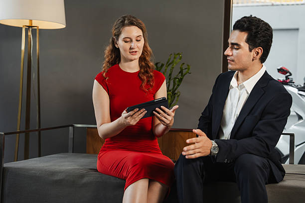 istock Two professional business people working together with tablet computer 2239151285