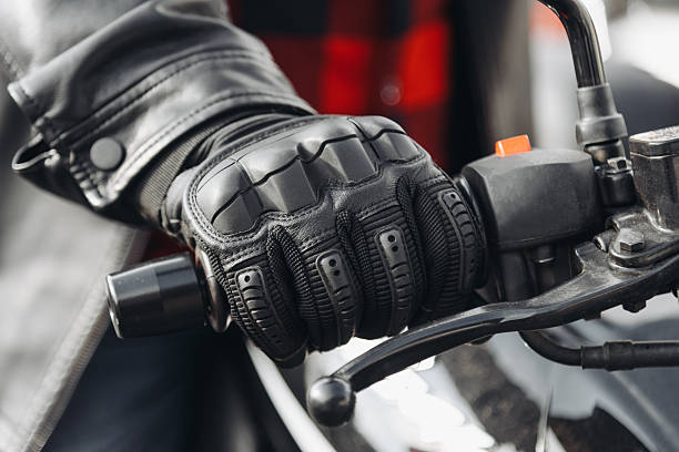 istock man hand in black leather glove on motorcycle handle 2239153421