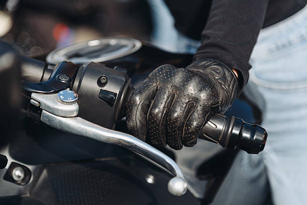 istock woman hand on black motorcycle handle 2239153481
