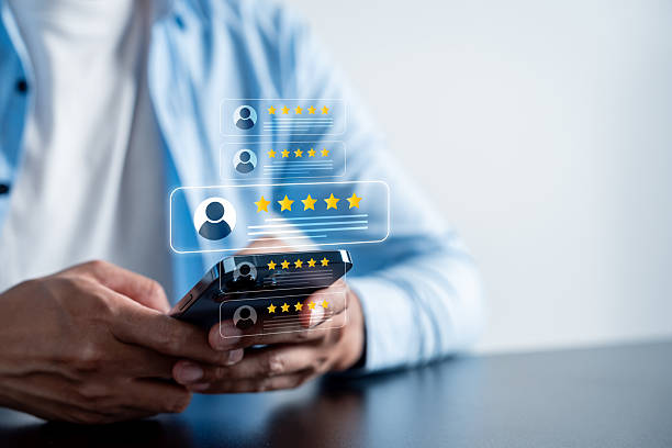 istock Customer review giving five star reviews using a smartphone, concept of online feedback, user rating, and reputation management in digital marketing and e-commerce. 2239160784