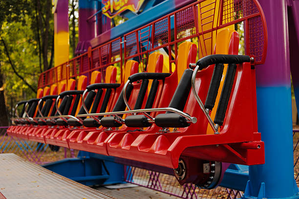 Colorful extreme attraction seats at amusement park