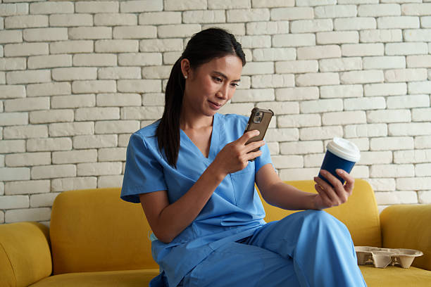 istock Doctors are taking selfies while drinking coffee and relaxing while waiting to examine patients in the hospital. 2239164086