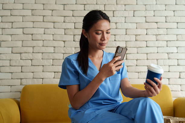 istock Doctors are taking selfies while drinking coffee and relaxing while waiting to examine patients in the hospital. 2239164106