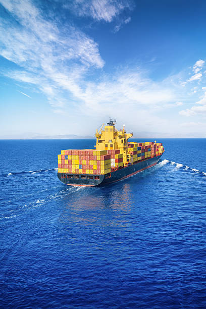istock Rear view of a loaded container ship sailing over the ocean 2239165060
