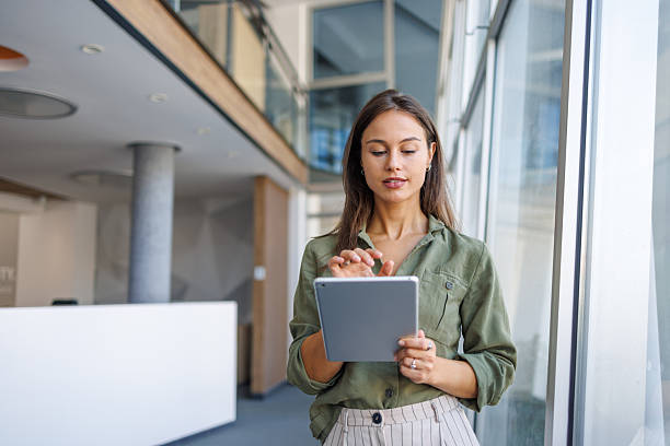 istock Businesswoman using digital tablet in modern office 2239165760