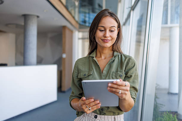 istock Woman working on tablet in modern office environment 2239165795
