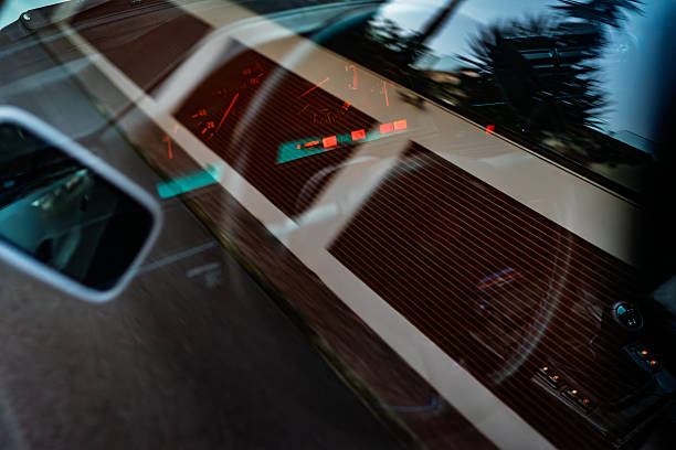 istock Classic car steering wheel dial reflection from glass outside view 2239168829