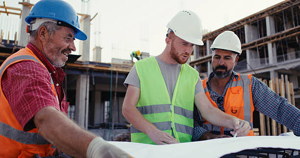 istock Civil engineer, foreman and master are discussing on the progress plan and the project at construction site 2239170797