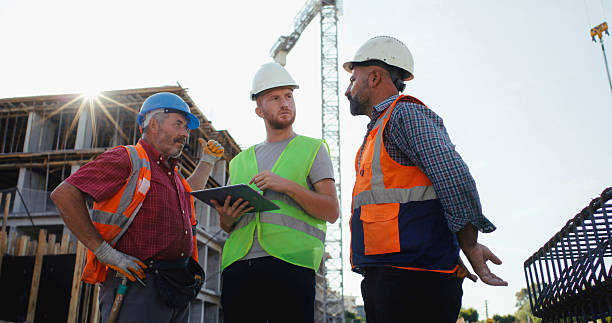 istock Civil engineer, foreman and master are discussing on the progress plan and the project at construction site 2239171440