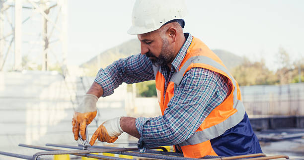 istock Construction master wiring steel reinforcement cage for columns at construction site 2239171558