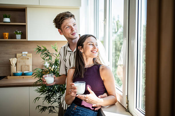 istock Young couple enjoying morning coffee in modern kitchen 2239171637