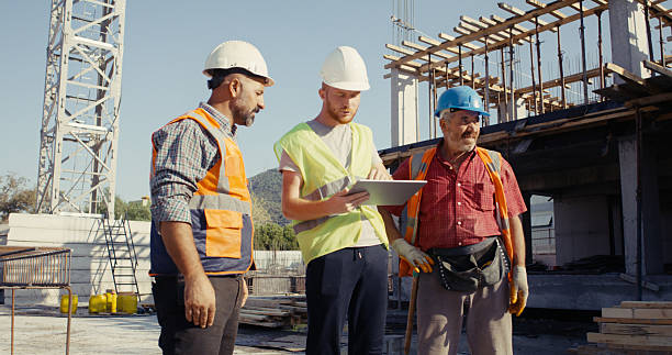 istock Civil engineer, foreman and master are discussing on the progress plan and the project at construction site 2239171643