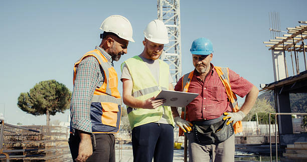 istock Civil engineer, foreman and master are discussing on the progress plan and the project at construction site 2239172405