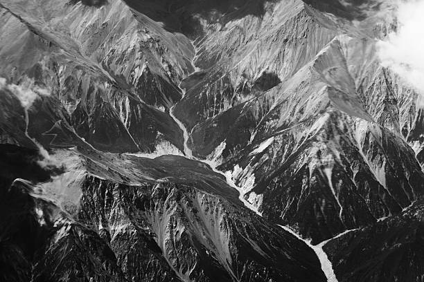 istock Aerial View of Rugged Mountain Range in Black and White 2239176830